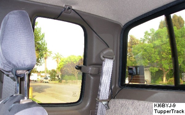 the duleo gps unit attached to the rear window with double sided foam tape